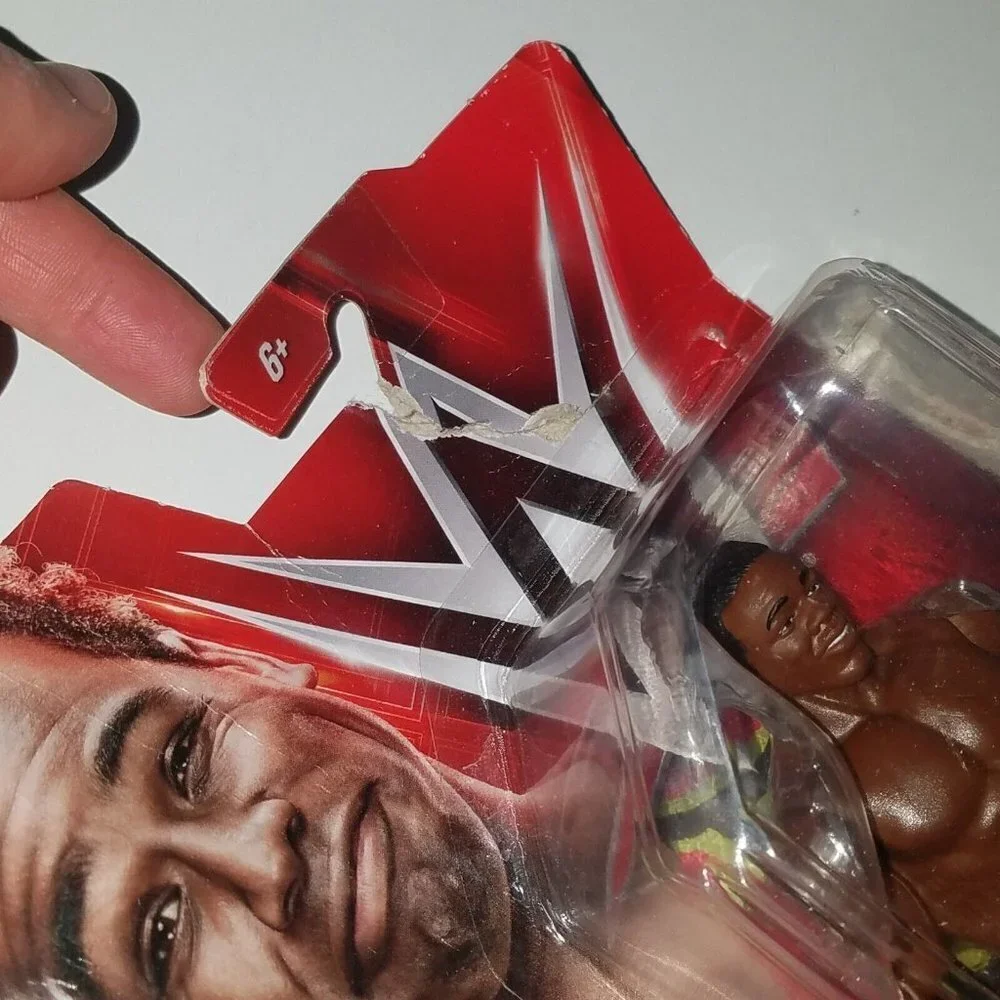 WWE Xavier Woods Action Figure (new toy with noticeable packaging wear) AS IS